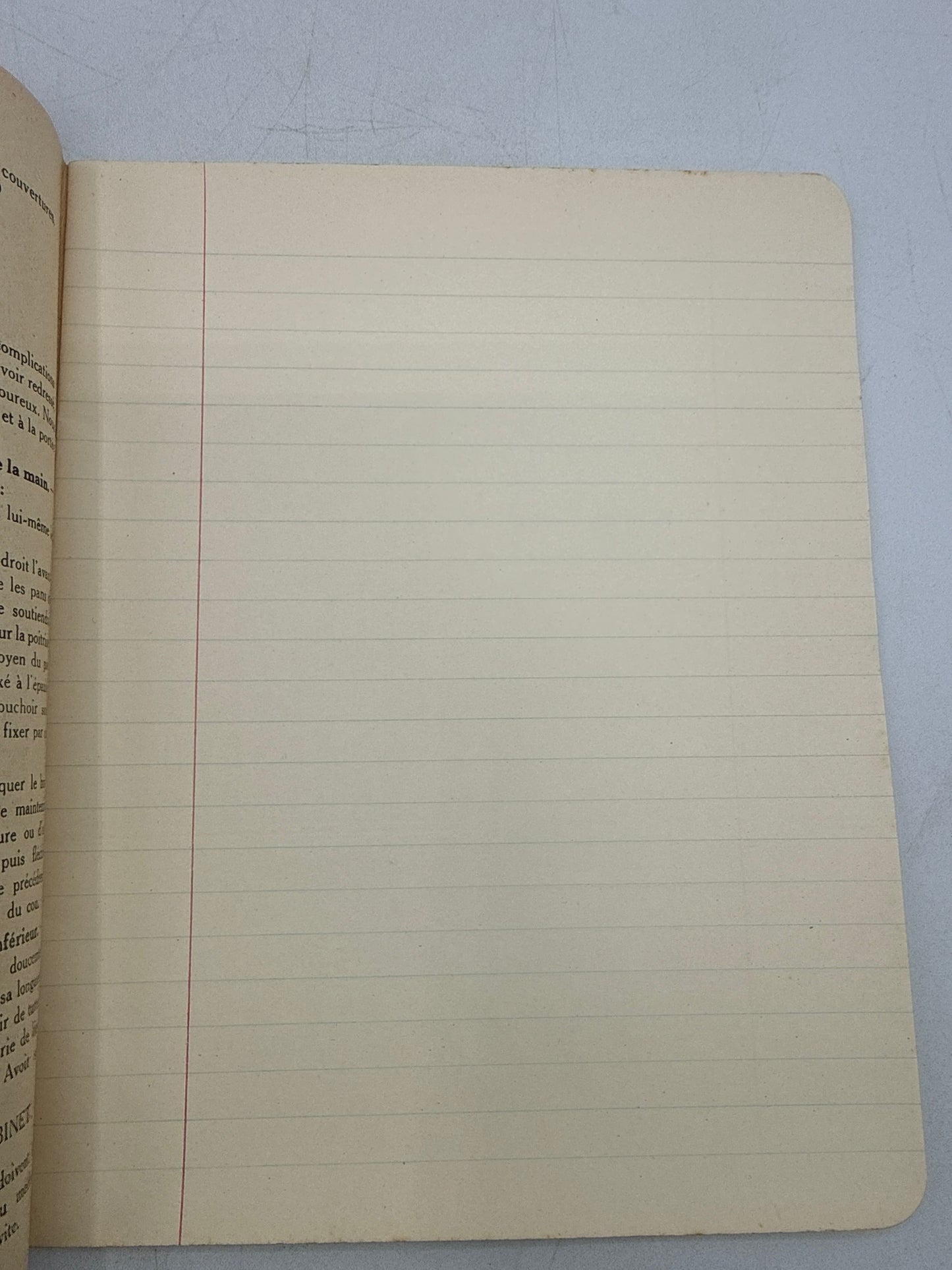 Open notebook with lined pages on a light blue background
