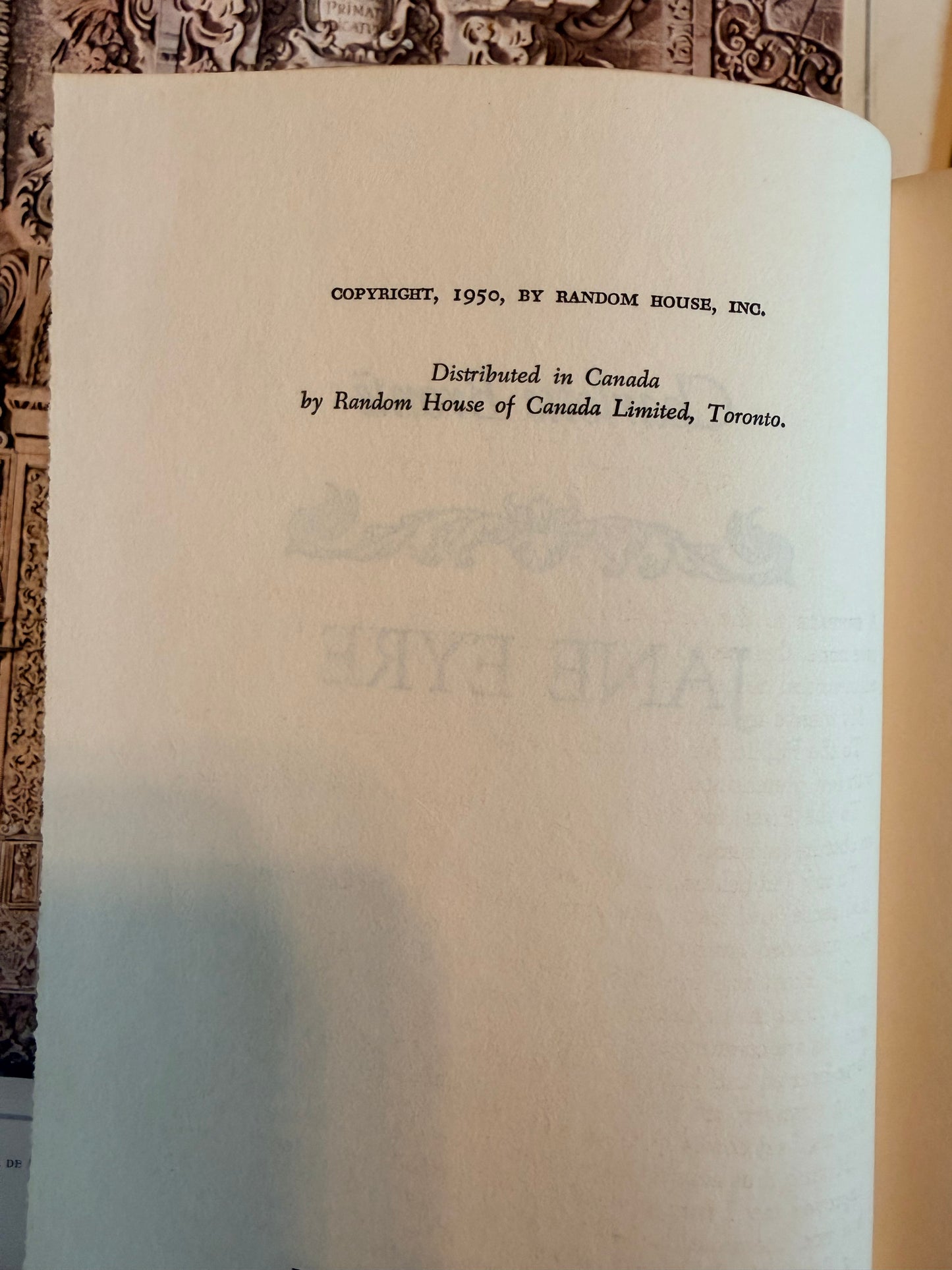 Close-up of a book page with text and watermarks.