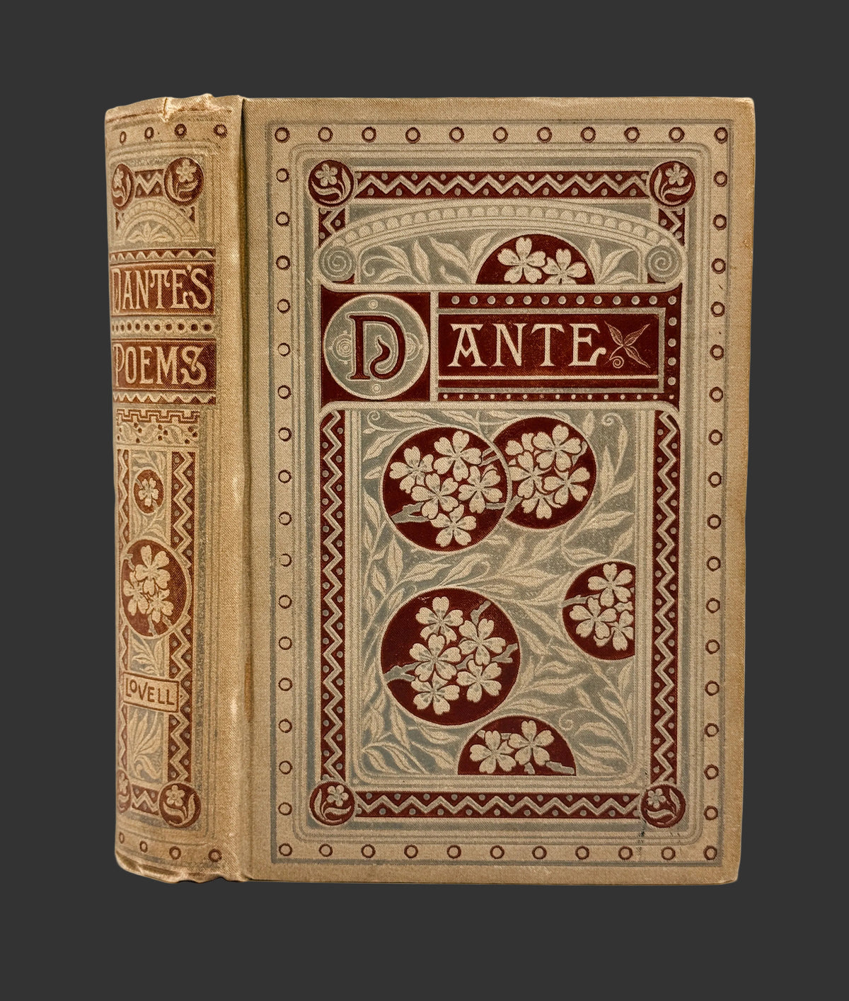An antique hardcover book titled 'Dante's Poems' with ornate embossed floral and geometric designs in dark red-brown and beige on a white background.