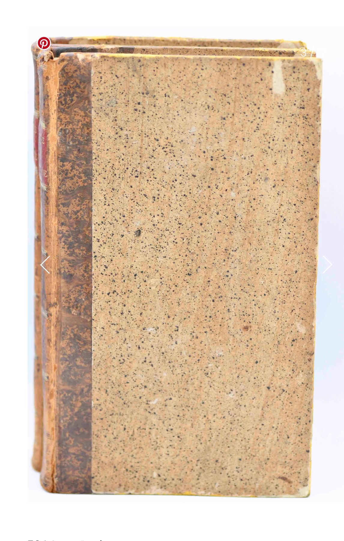 Vintage book with worn leather binding on a white background