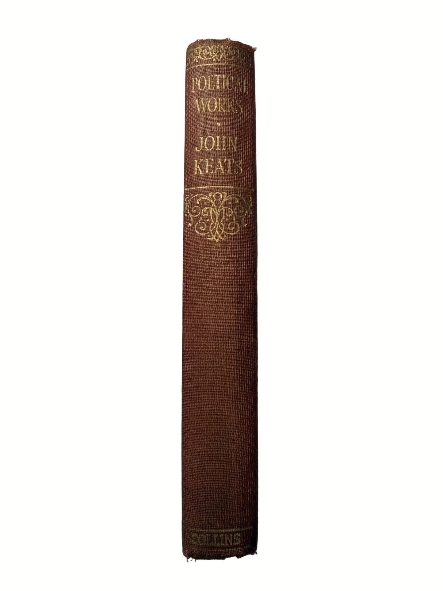 Brown book with gold embossed text on a white background