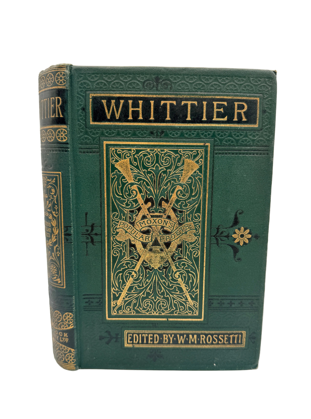 A vintage hardcover book titled 'Whittier' with ornate gold embossed detailing on a dark green cover, photographed against a plain white background.