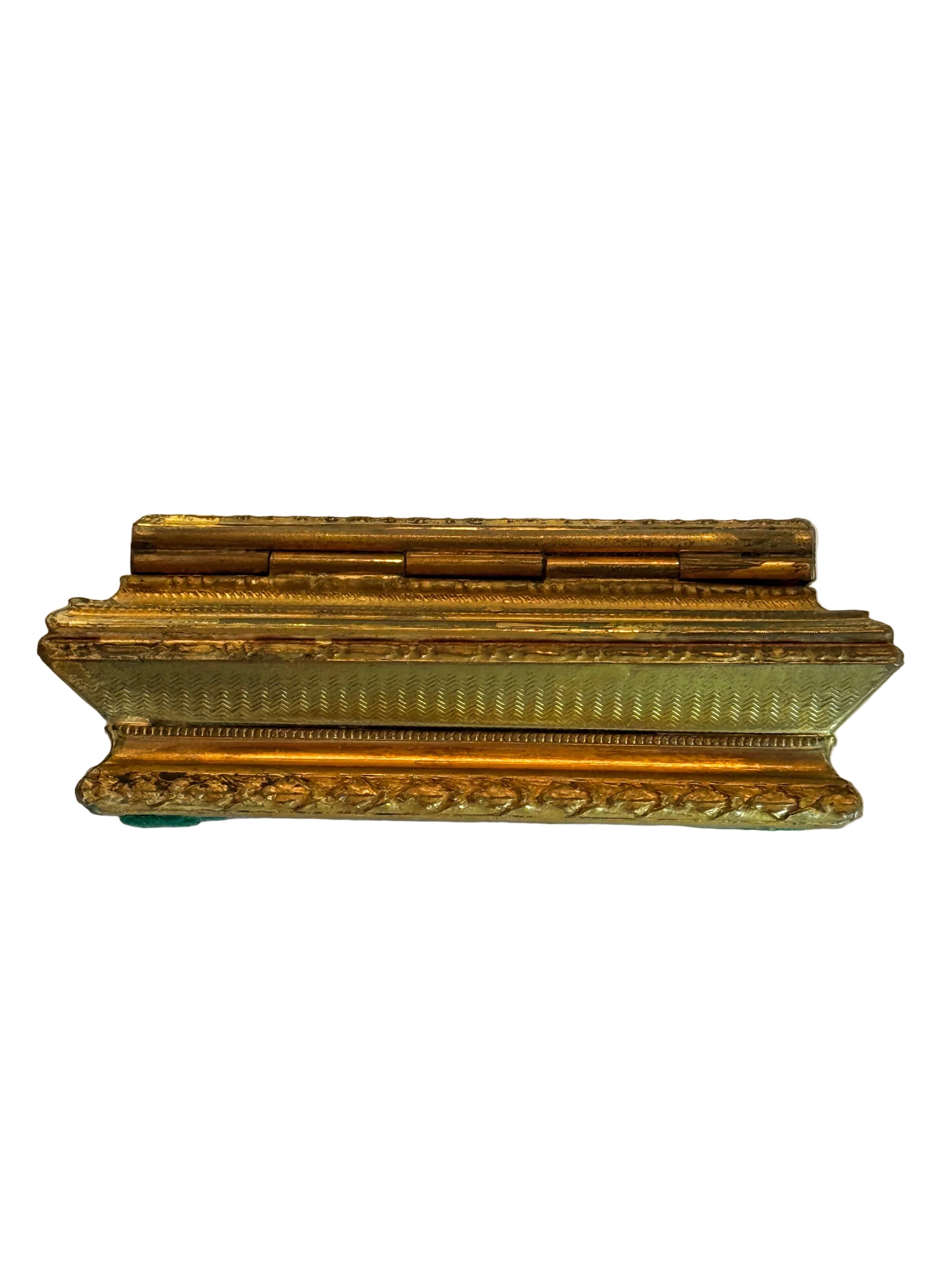 Decorative gold frame on a white fabric background
