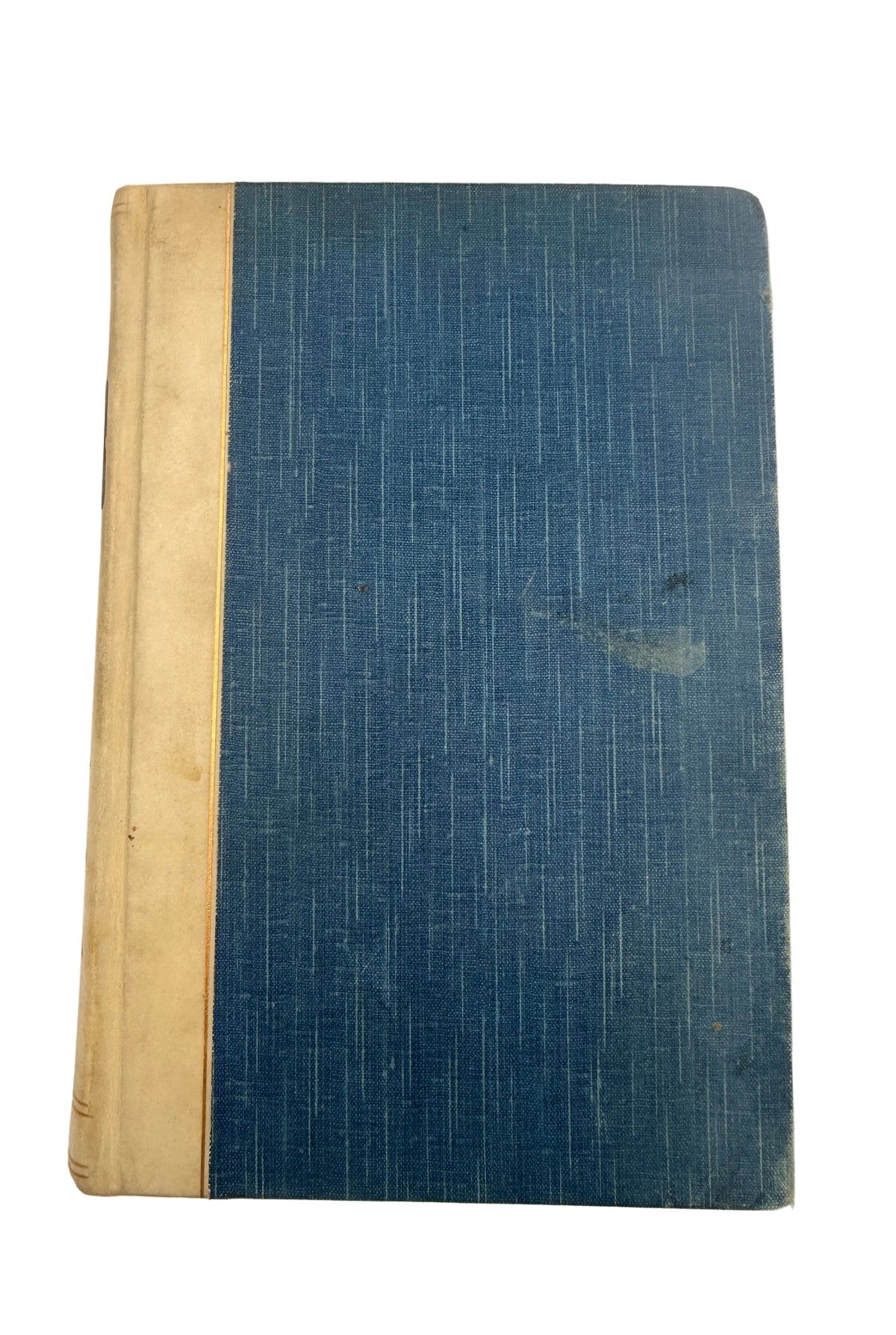 A vintage hardcover book with a textured blue linen cover and a beige cloth spine, photographed flat against a light off-white background.