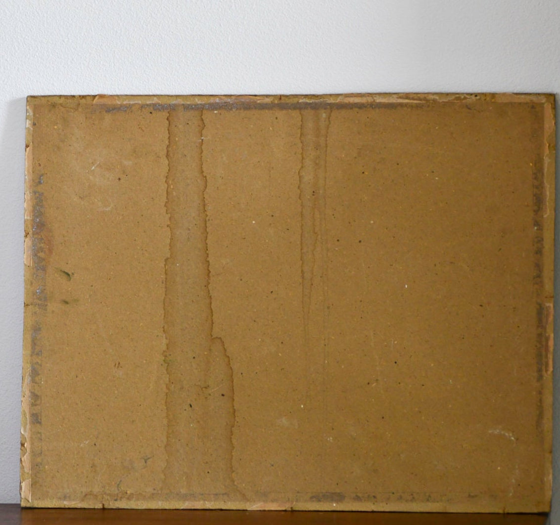 Brown back of painting hardboard with visible wear on a white background