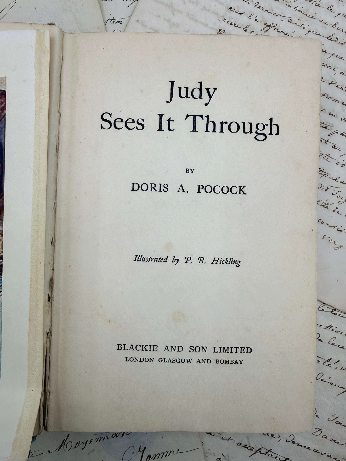 Title page of a book titled 'Judy Sees It Through' by Doris A. Pocock, with text on a textured background.