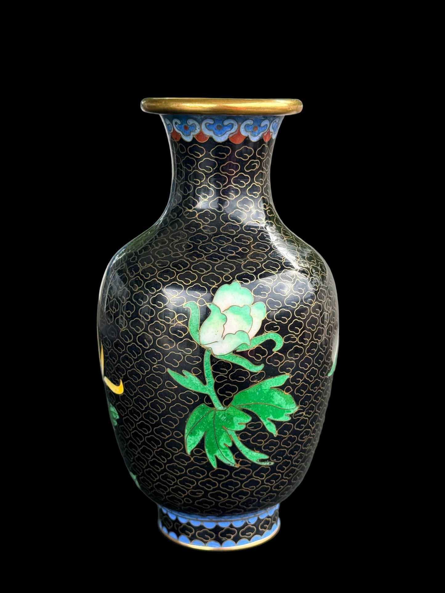Decorative vase with floral design on a plain background