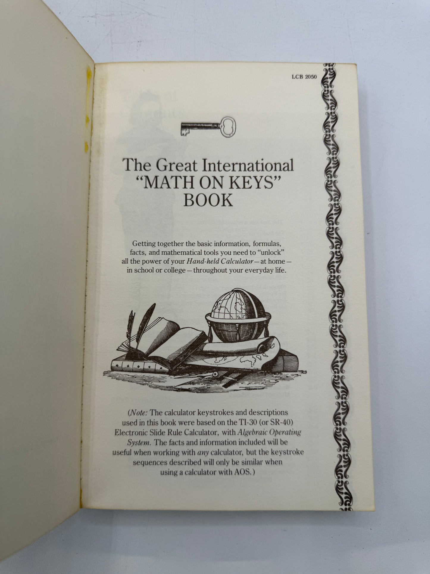 Booklet titled 'The Great International Math on Keys Book' with a key and calculator illustration on a white background.