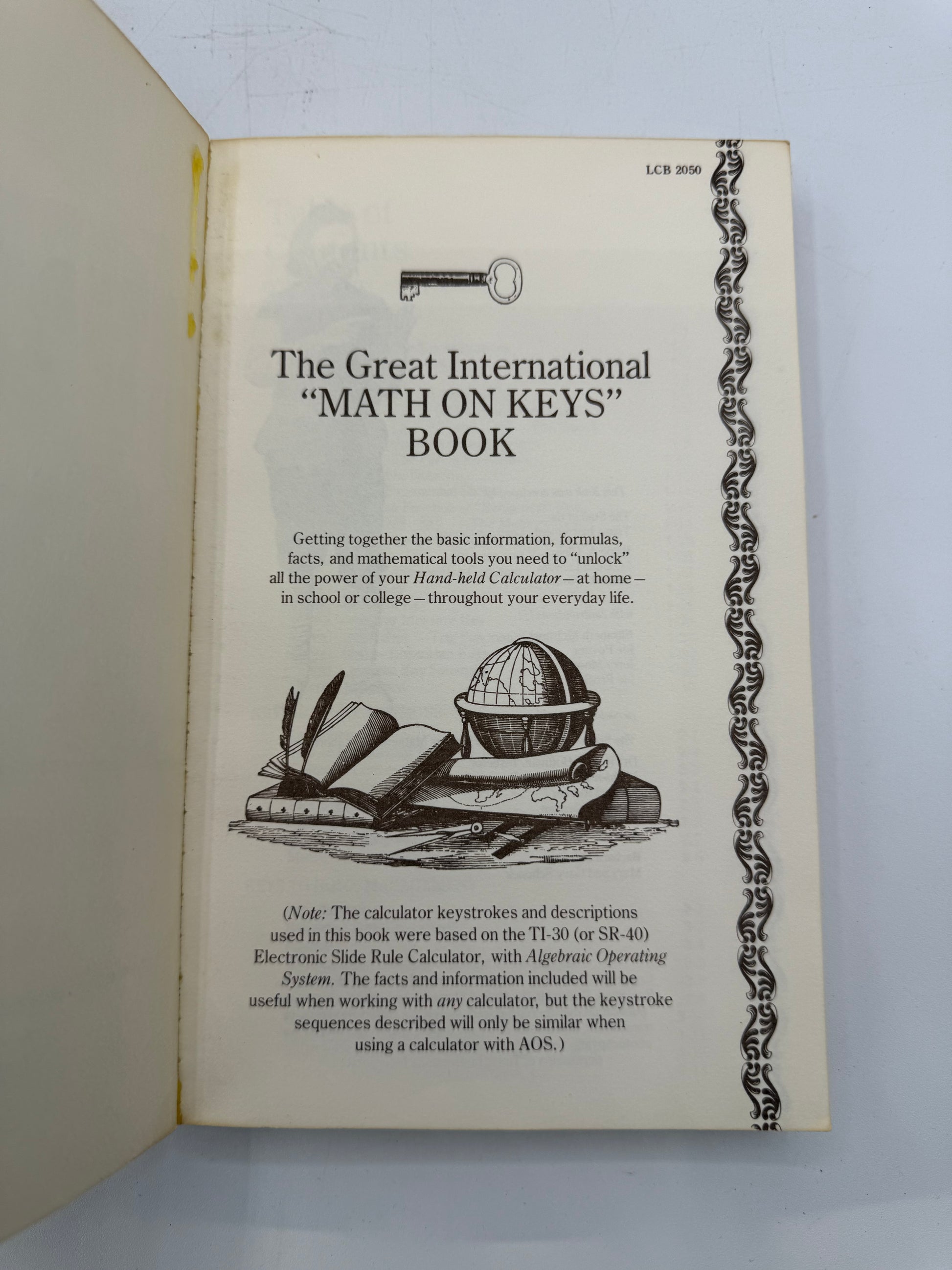 Booklet titled 'The Great International Math on Keys Book' with a key and calculator illustration on a white background.