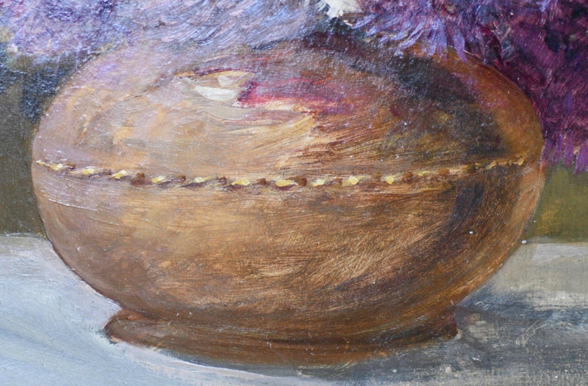 Wooden bowl with decorative edge on a textured canvas painting surface