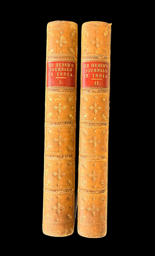 Two volumes of 'Journals in India' with decorative spines on a gray background