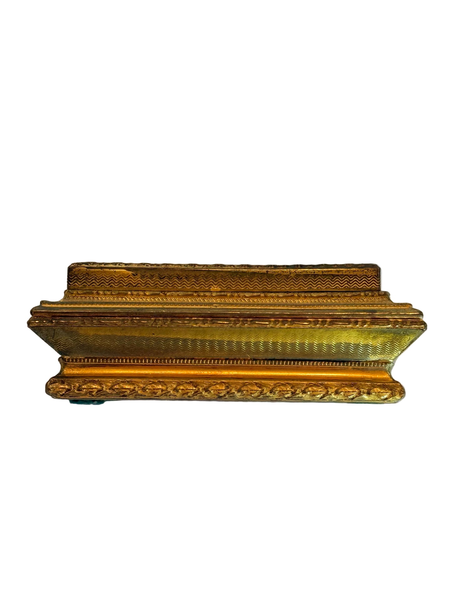 Decorative gold frame on a white fabric background