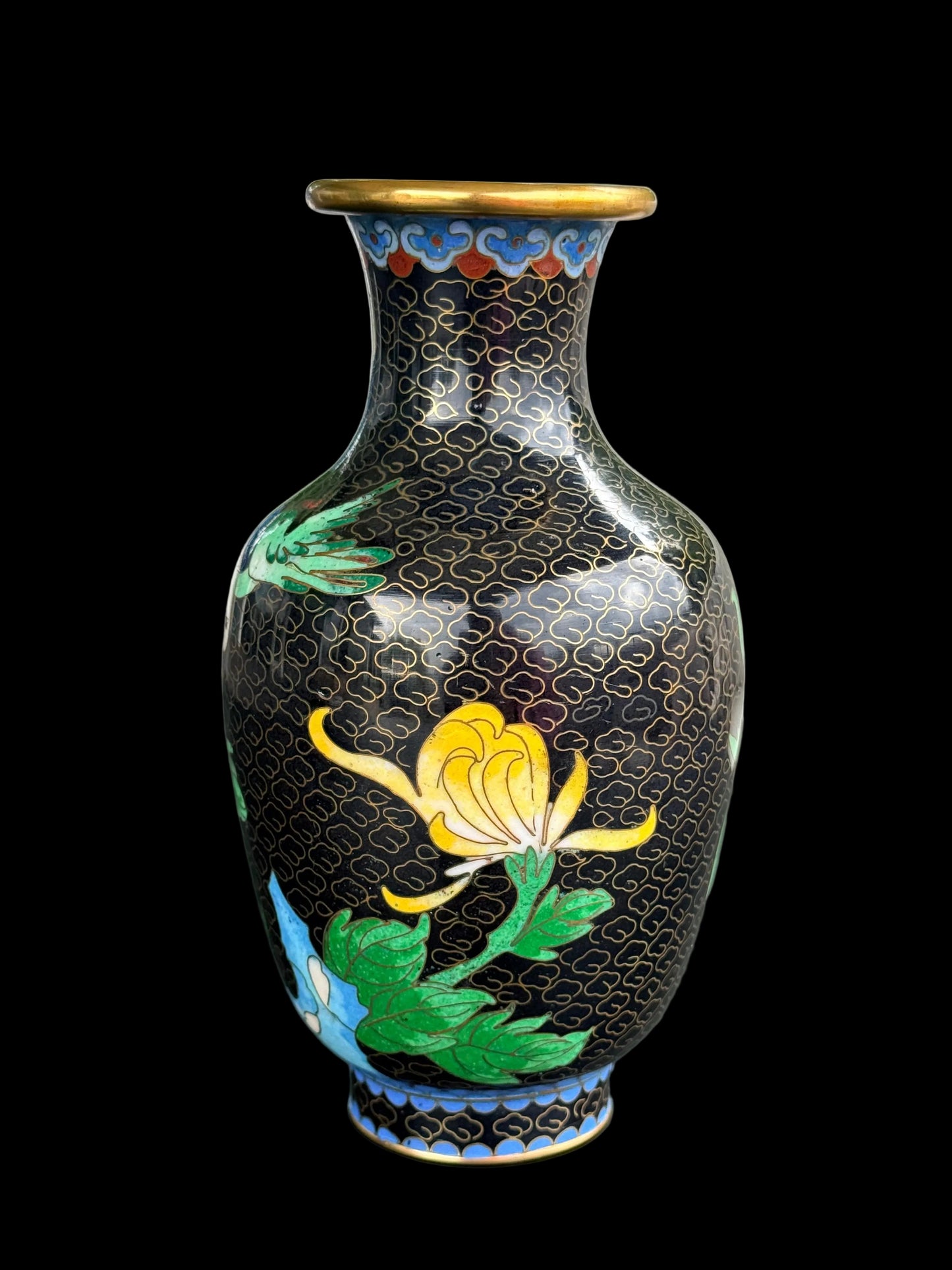 Decorative vase with floral design on a plain background