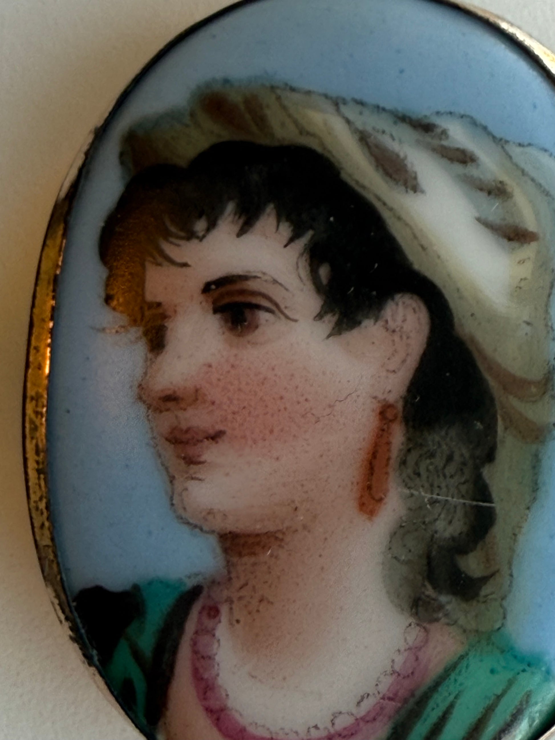 Vintage portrait miniature of a woman with a bonnet on a white background