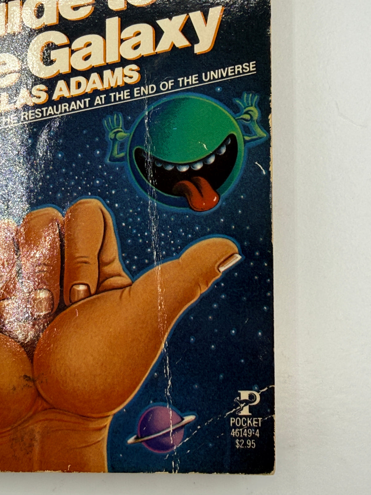 The Hitchhiker’s Guide to the Galaxy by Douglas Adams, paperback