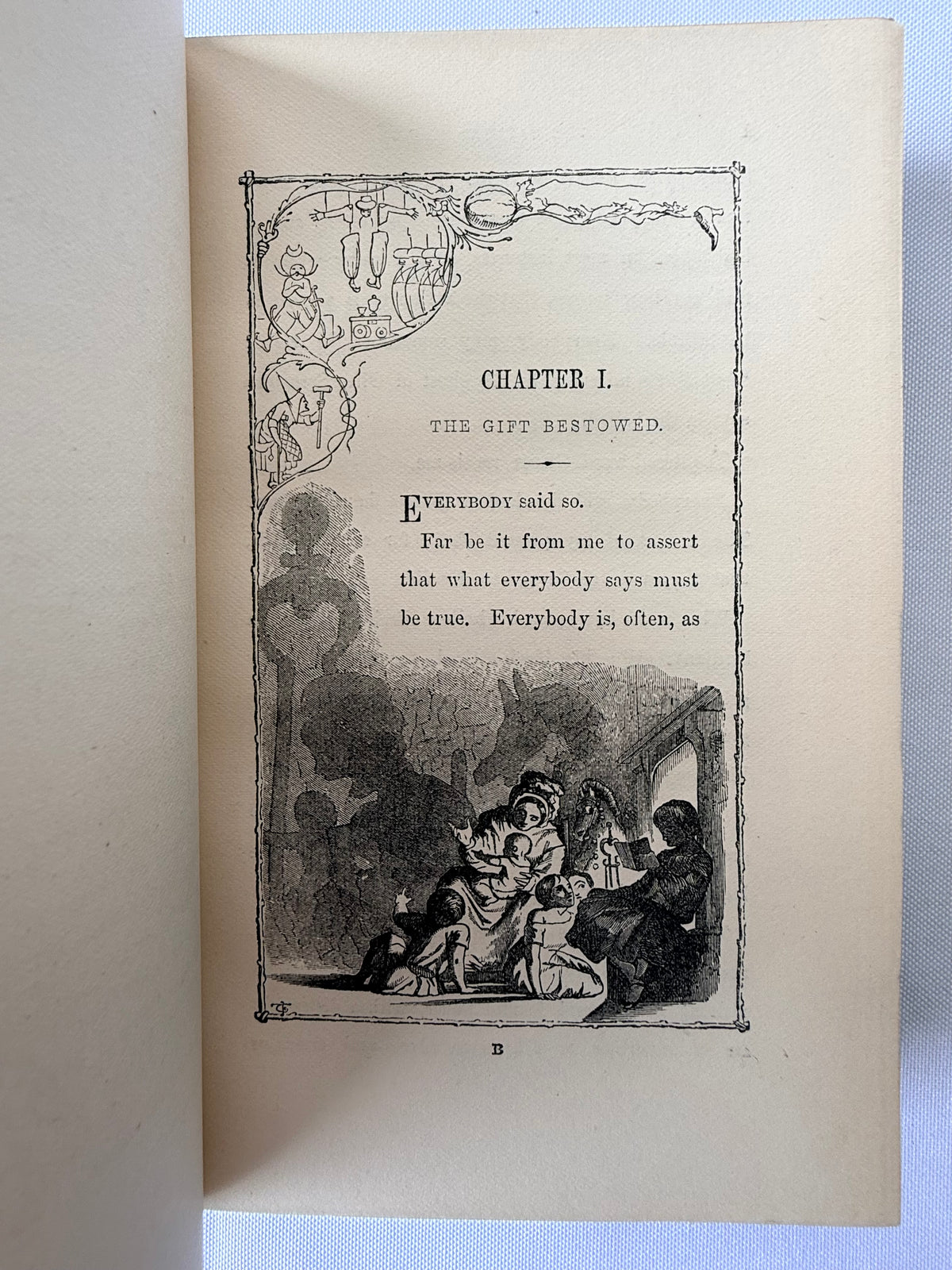 An open vintage book showing a printed interior page with decorative black-and-white illustration and the title 'CHAPTER I. THE GIFT RESTORED.