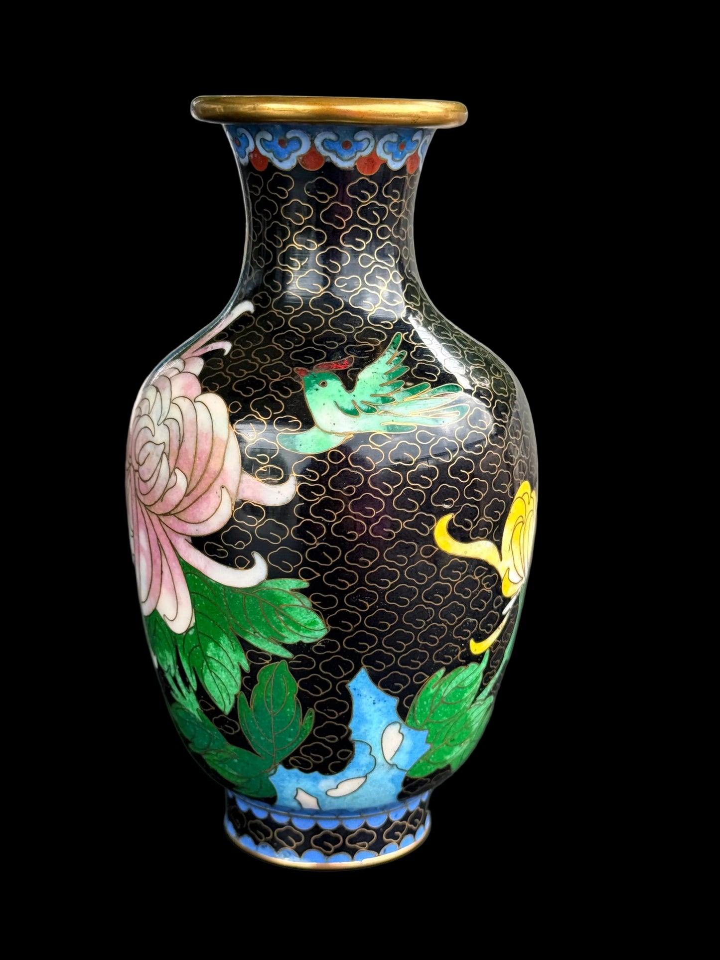 Decorative vase with floral patterns on a blurred background