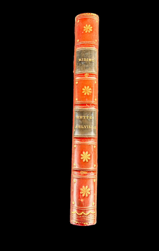 Red book with decorative cover on a black background
