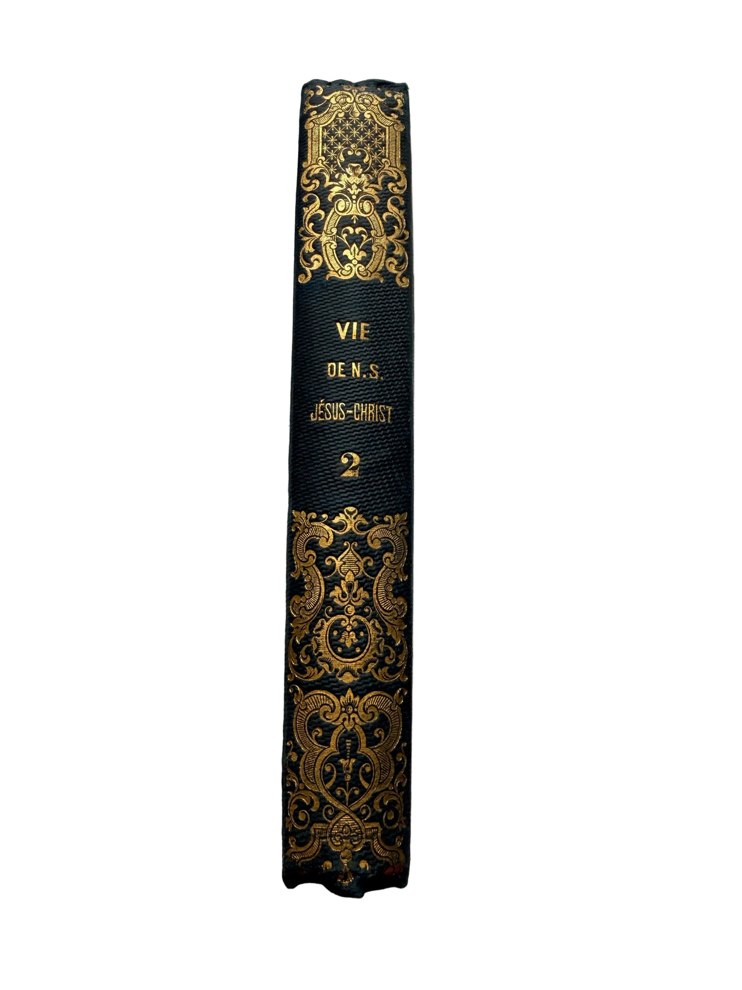 Decorative black and gold book on a marble surface