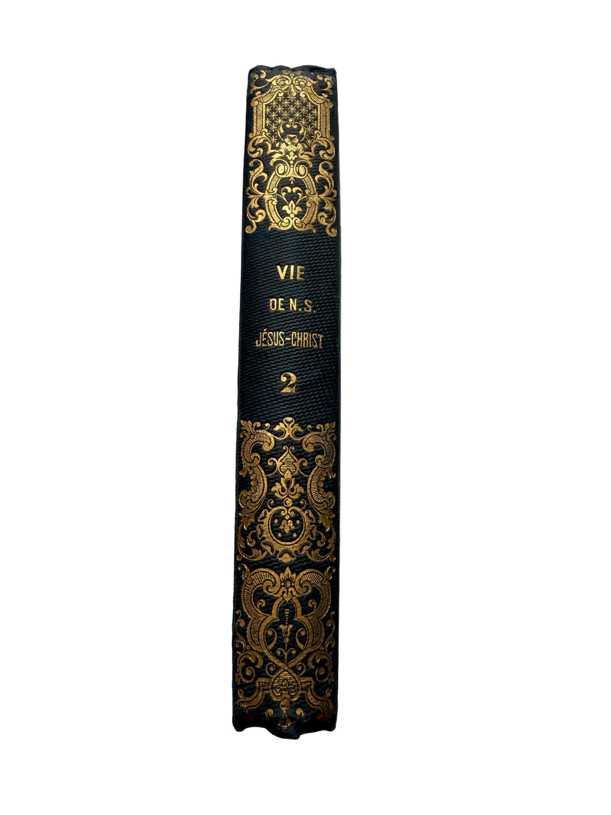 Decorative black and gold book on a marble surface