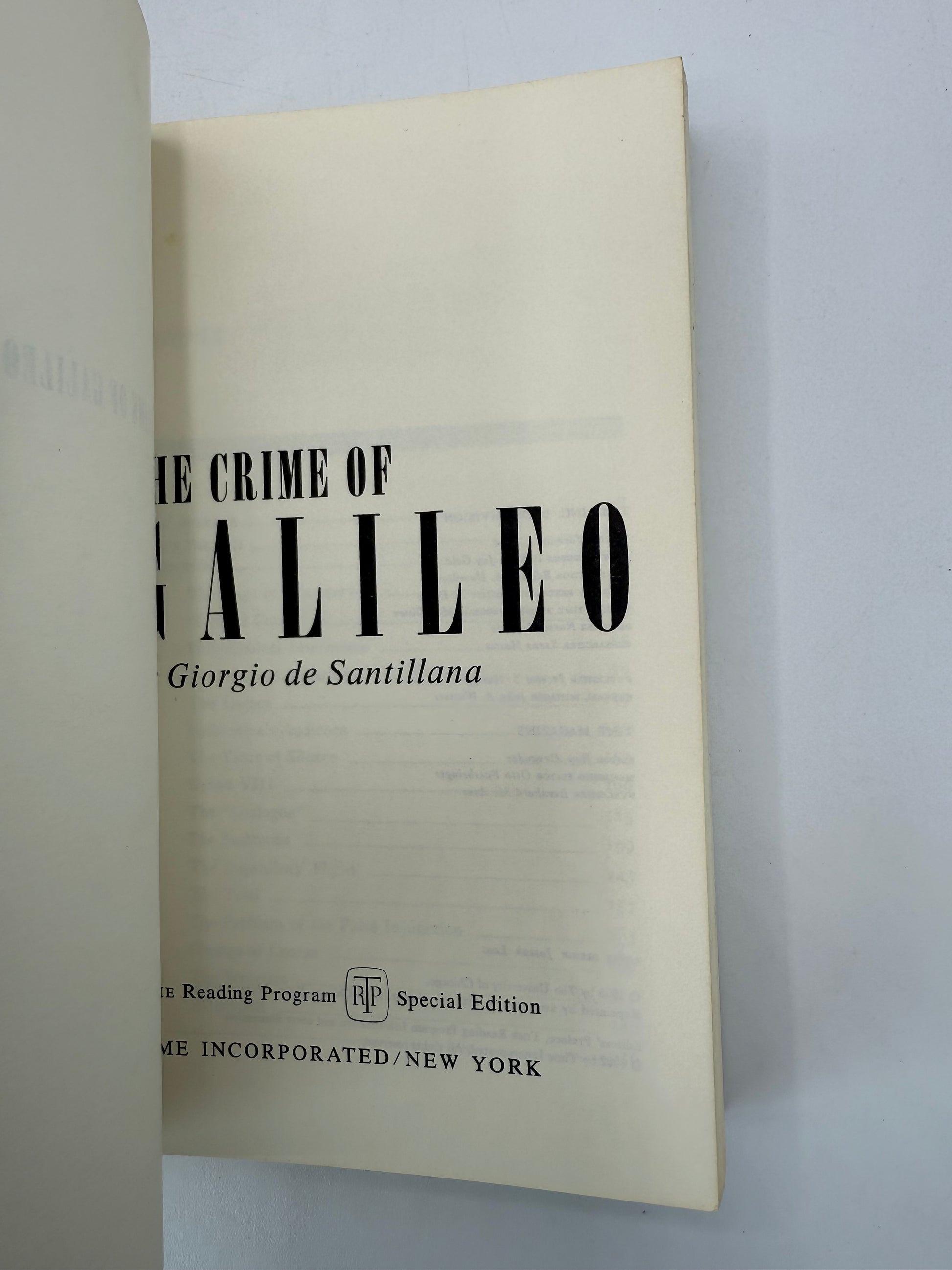 Book titled 'The Crime of Galileo' by Giorgio de Santillana on a light gray background