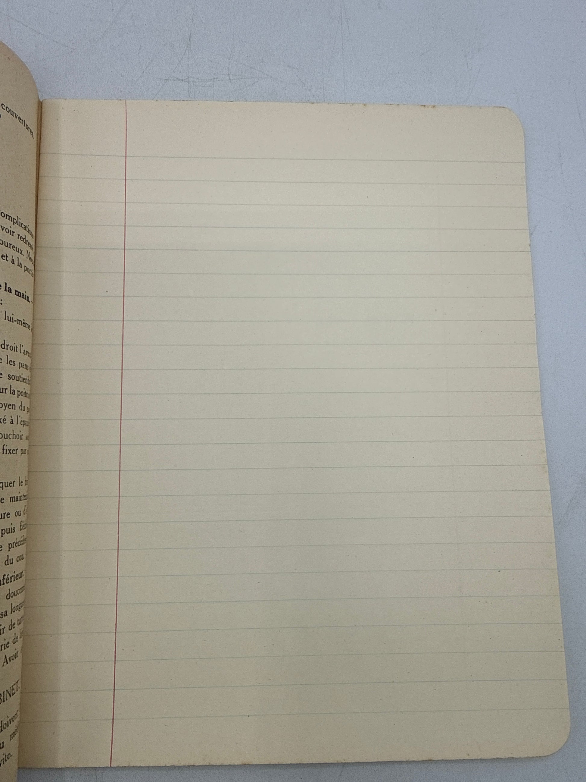 Open notebook with lined pages on a light blue background