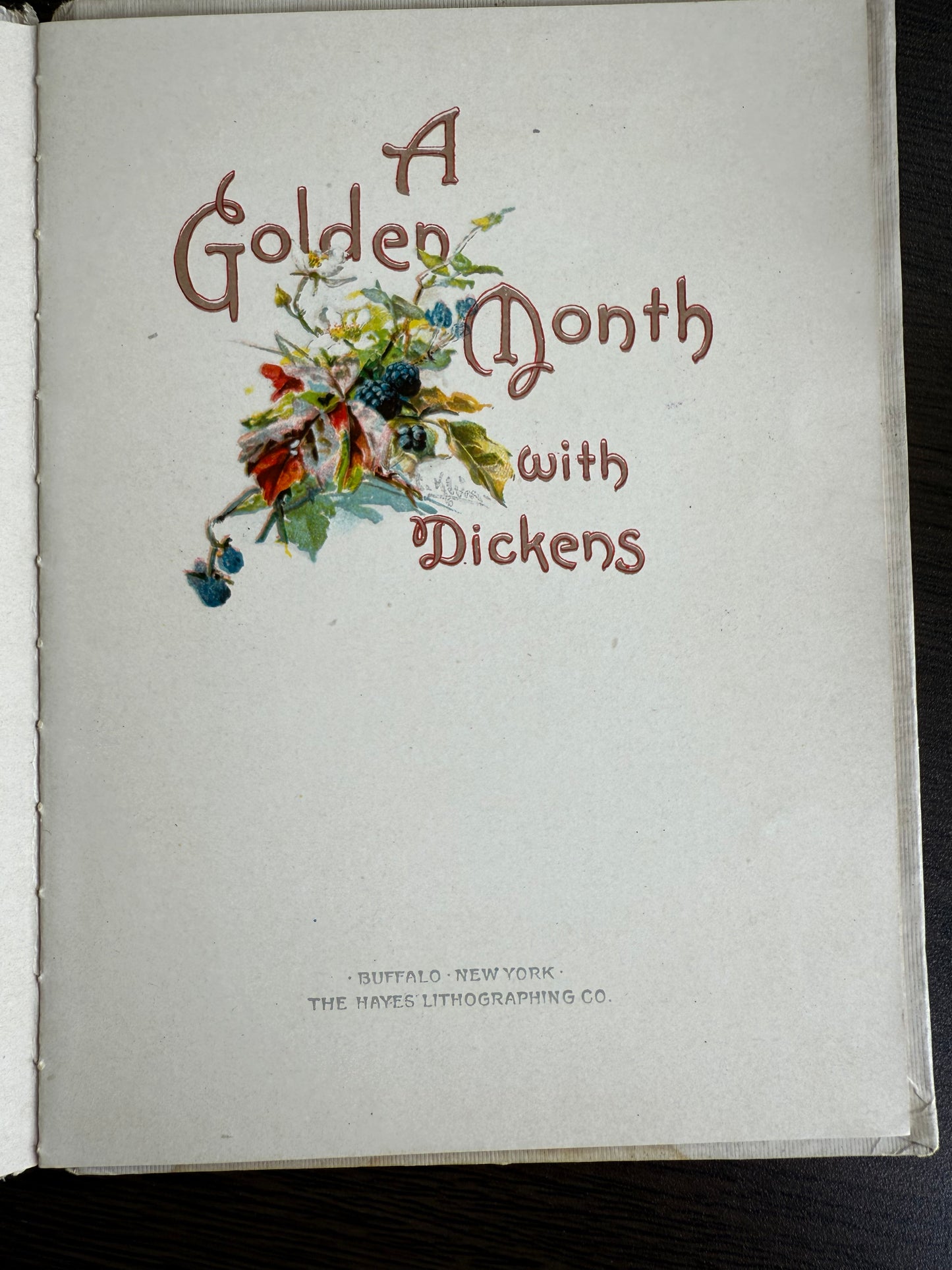 Book titled 'A Golden Month with Dickens' on a white background
