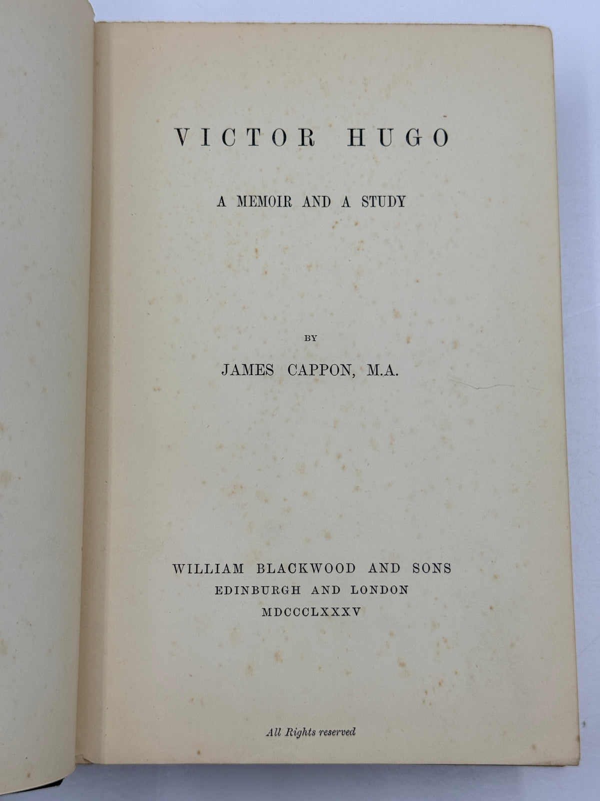 An open vintage book showing the title page for 'Victor Hugo: A Memoir and a Study' by James Cappon, M.A.