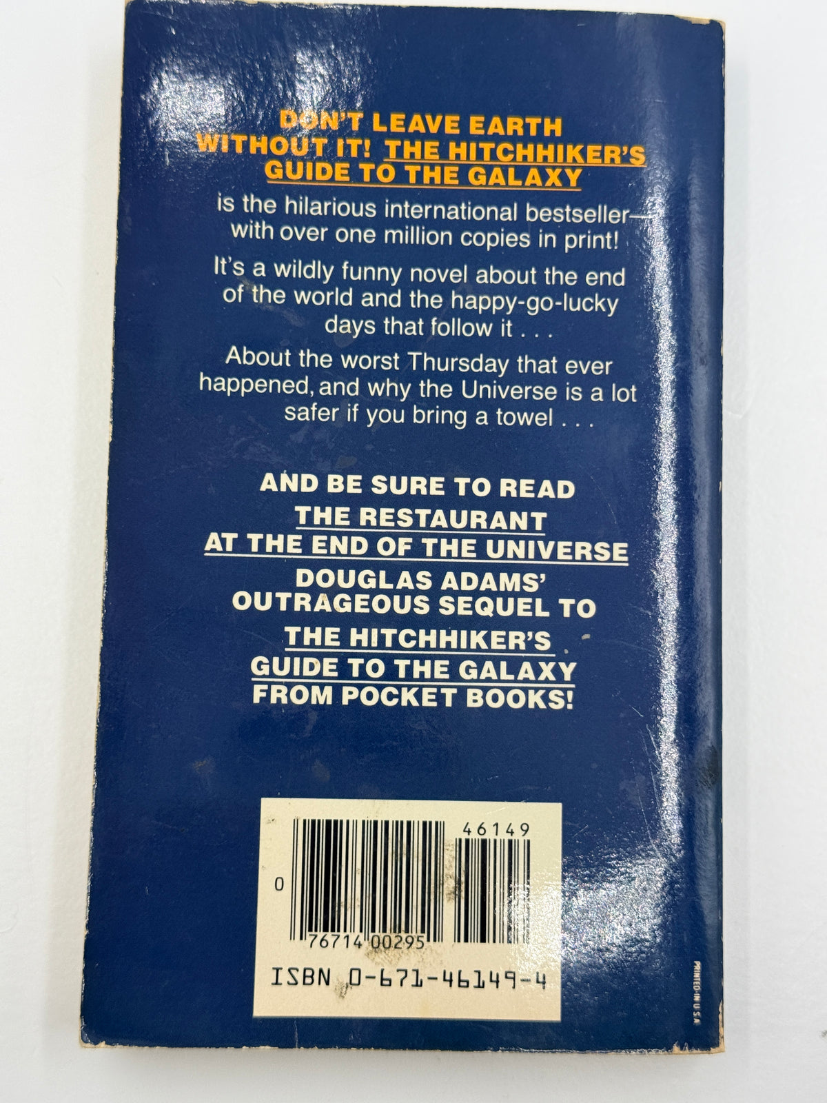 The Hitchhiker’s Guide to the Galaxy by Douglas Adams, paperback