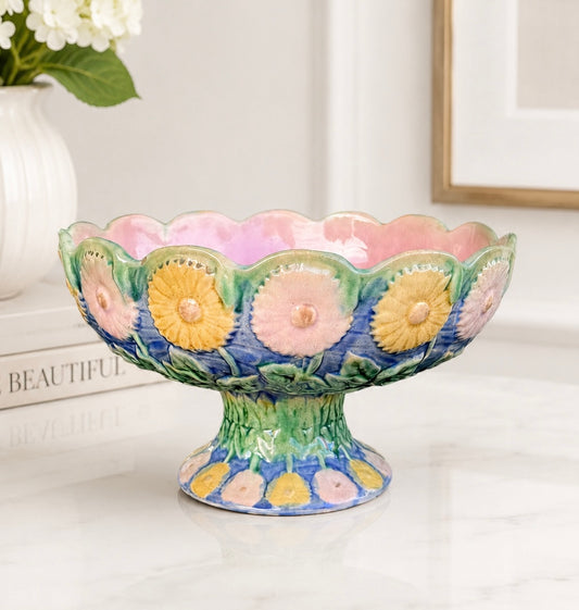 Decorative ceramic bowl with floral patterns on a white surface