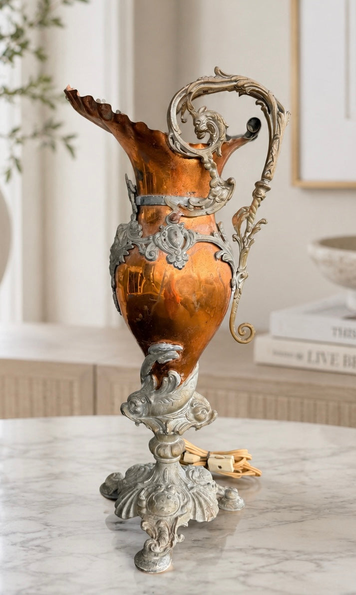 Decorative urn with intricate designs on a marble surface