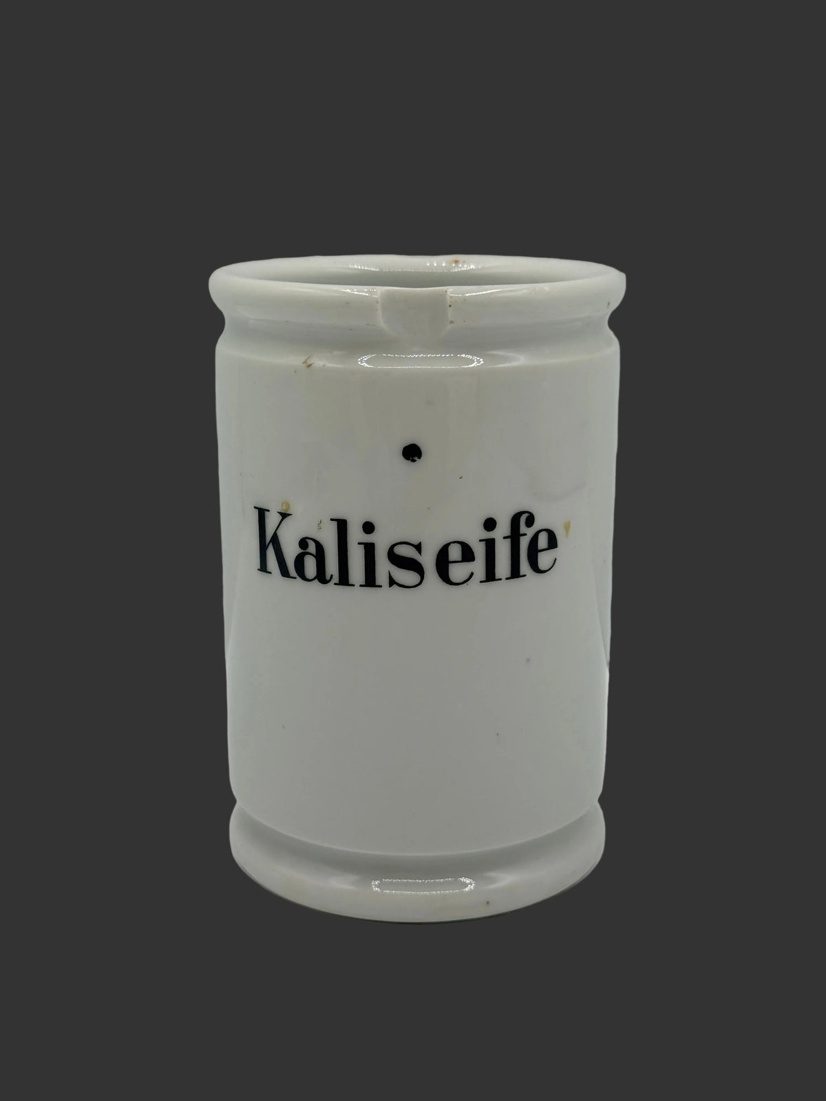 A white ceramic container with the word 'Kaliseife' printed in black on the front, photographed against a plain light gray background.