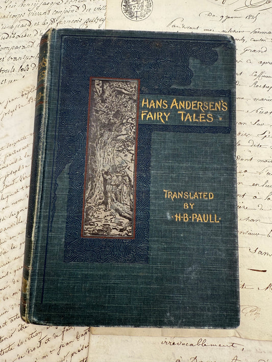 Vintage book titled 'Hans Andersen's Fairy Tales' on a textured paper background
