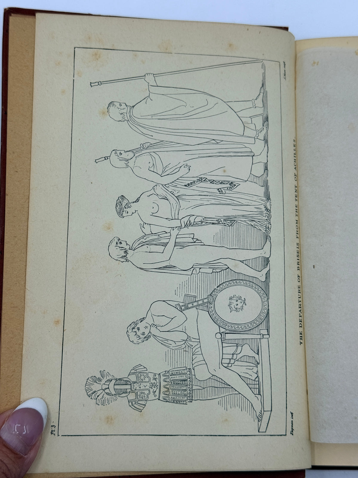 An open vintage book or journal showing a printed black-and-white illustration on the left page, with a hand holding the left edge. The right page is blank and aged.