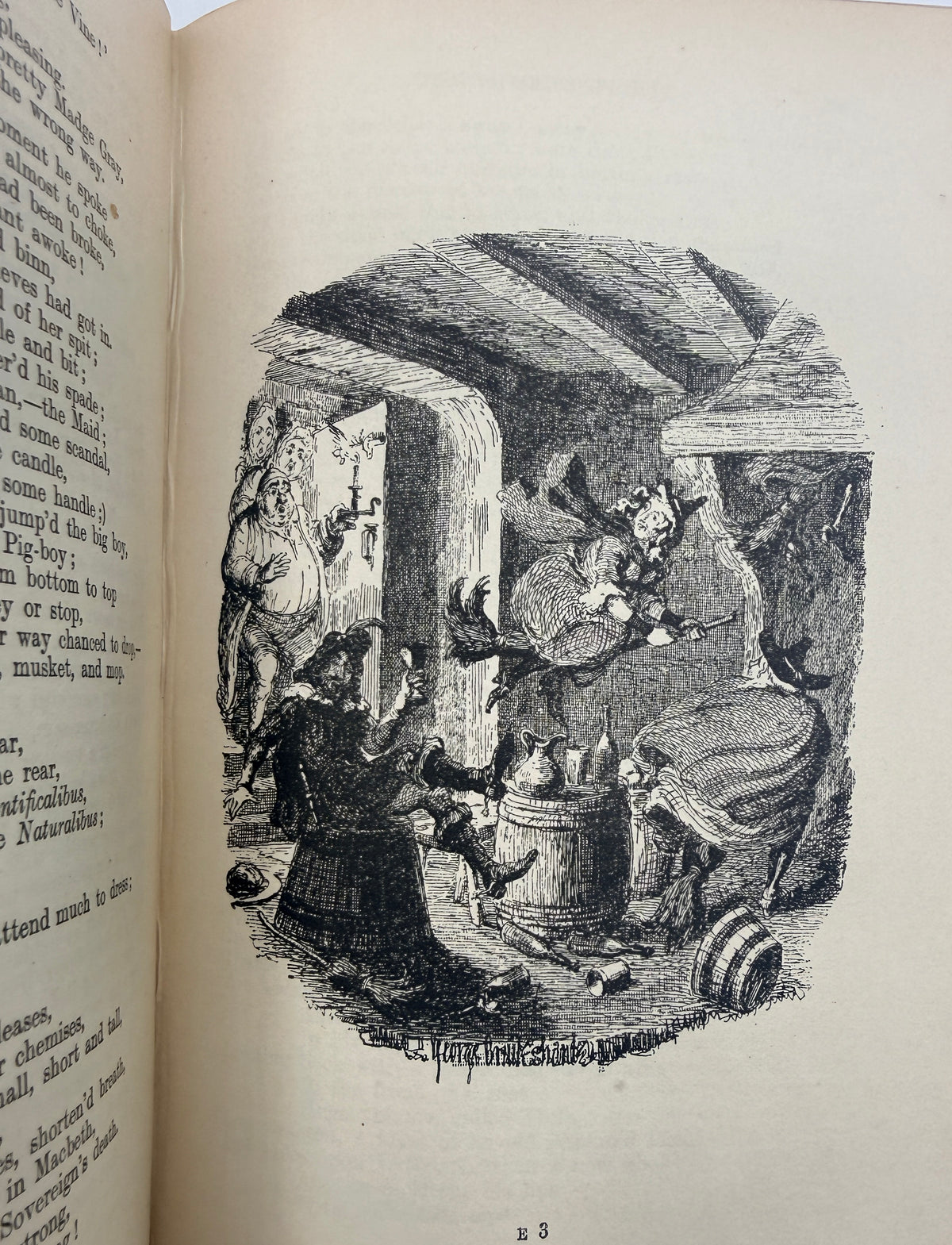 An open vintage book showing a black-and-white engraved illustration on the right page, with printed text visible on the left page. The illustration depicts a chaotic interior scene with several figures around a barrel or table.