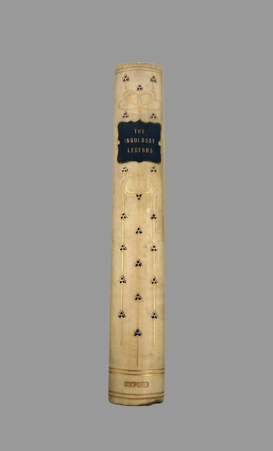 The front title page and decorative spine of the book 'The Incredible Legends' by Oxford, featuring a cream-colored cover with gold foil details and a black central label.