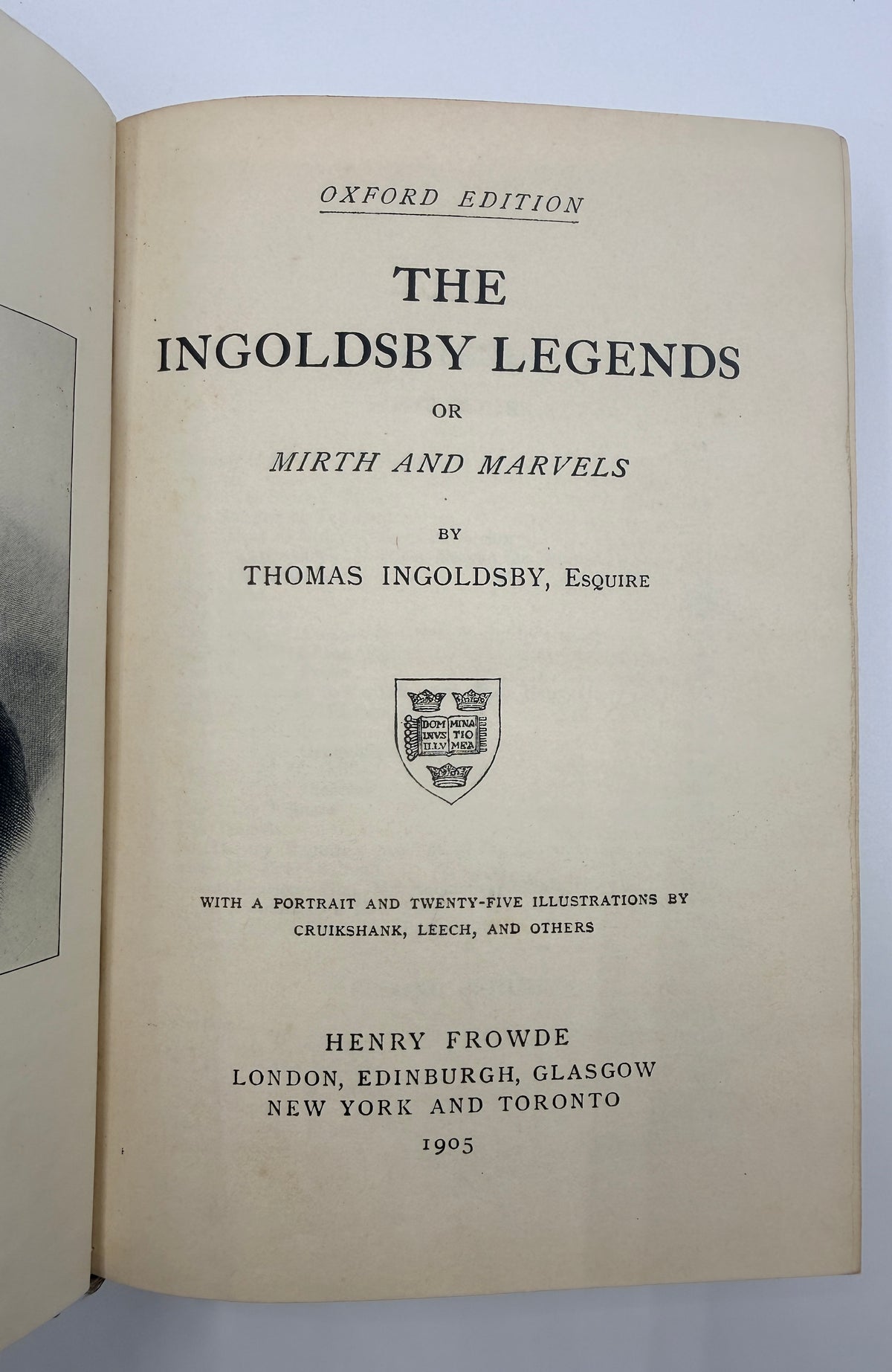 An open vintage book showing the title page of 'The Ingoldsby Legends or Mirth and Marvels' by Thomas Ingoldsby, Esquire, published in 1905. The page is printed in black on aged, warm beige paper with an Oxford Edition header and a small crest.