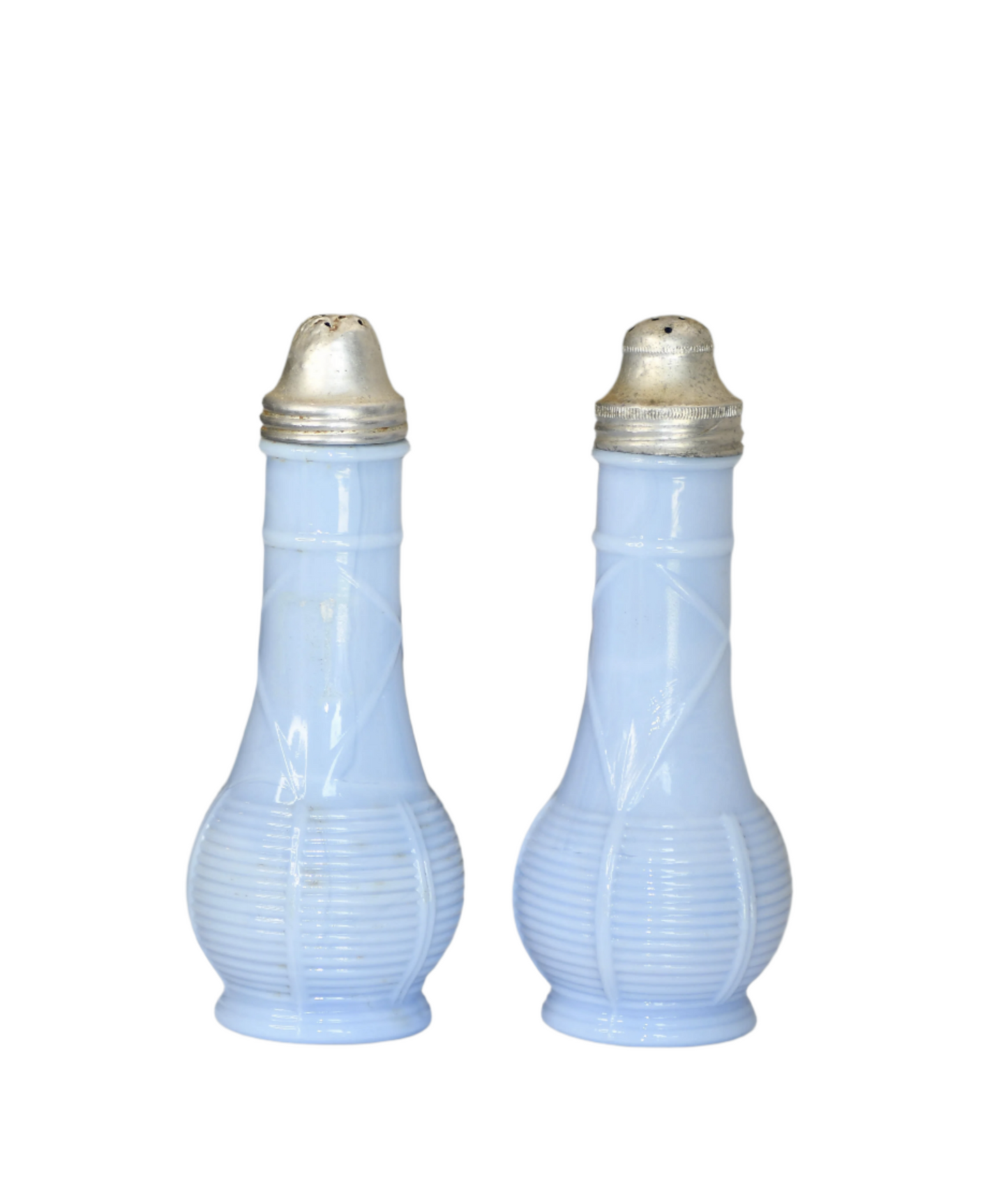 Two blue glass bottles with gold caps on a gray background