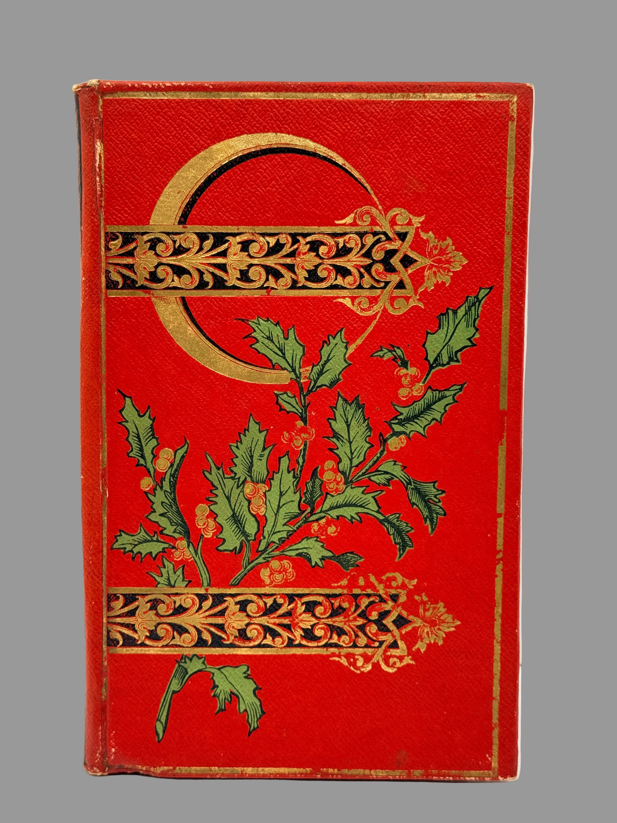 red french cartonnage style book with green leaves on the cover and gilt decoration. 