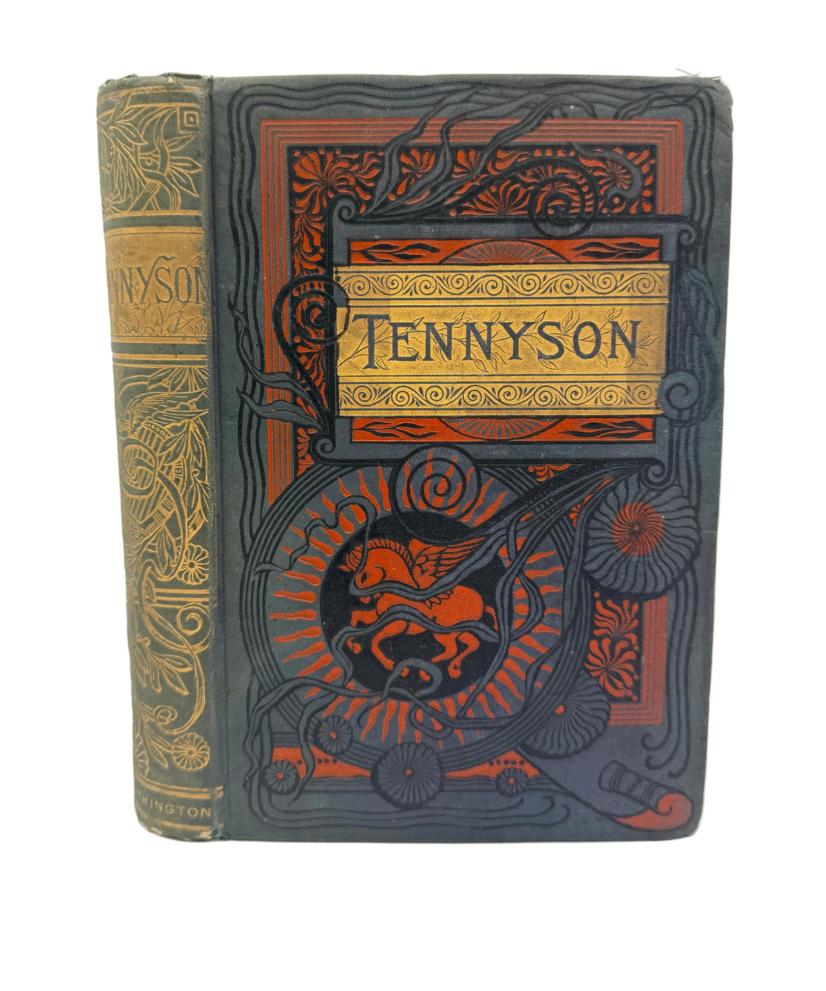 An antique hardcover book titled 'Tennyson' with ornate embossed floral and scrollwork on a dark navy cover, featuring orange-red decorative borders and a gold-toned title panel. The spine is visible on the left and shows matching gold detailing.