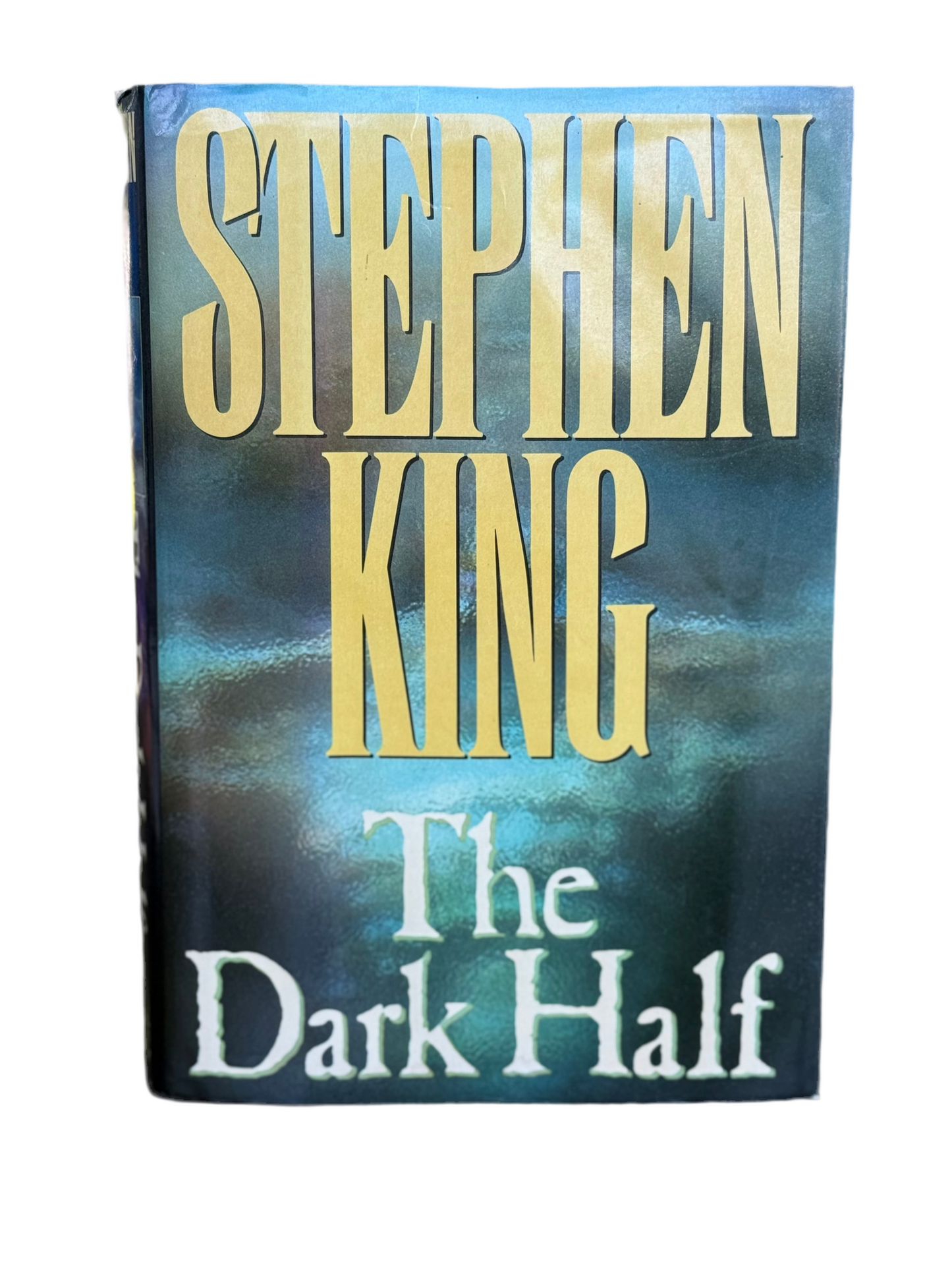 Book cover of 'The Dark Half' by Stephen King with a blue and black gradient background.