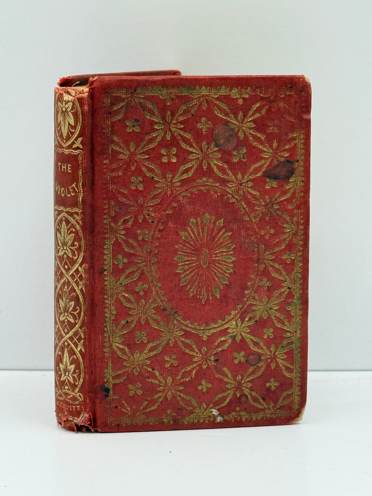 red cloth antique book with gilt decoration
