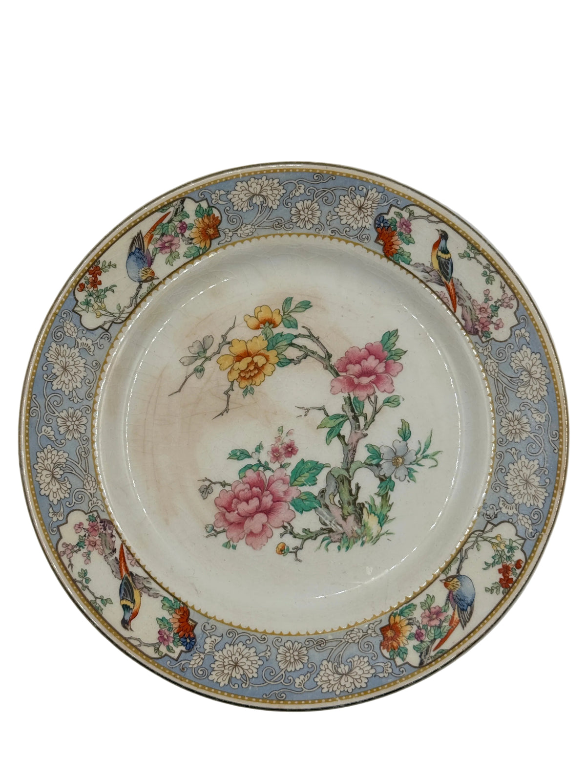 An antique Chinese porcelain plate featuring a central floral motif with pink and yellow blossoms, surrounded by a detailed border with birds and floral patterns on a light blue-gray background.