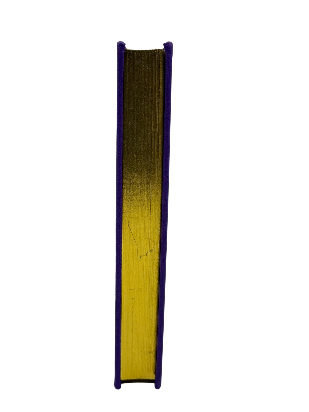A vintage hardcover book standing upright, showing its purple cloth-bound spine and gold-leaf-embellished pages, set against a plain light gray background.