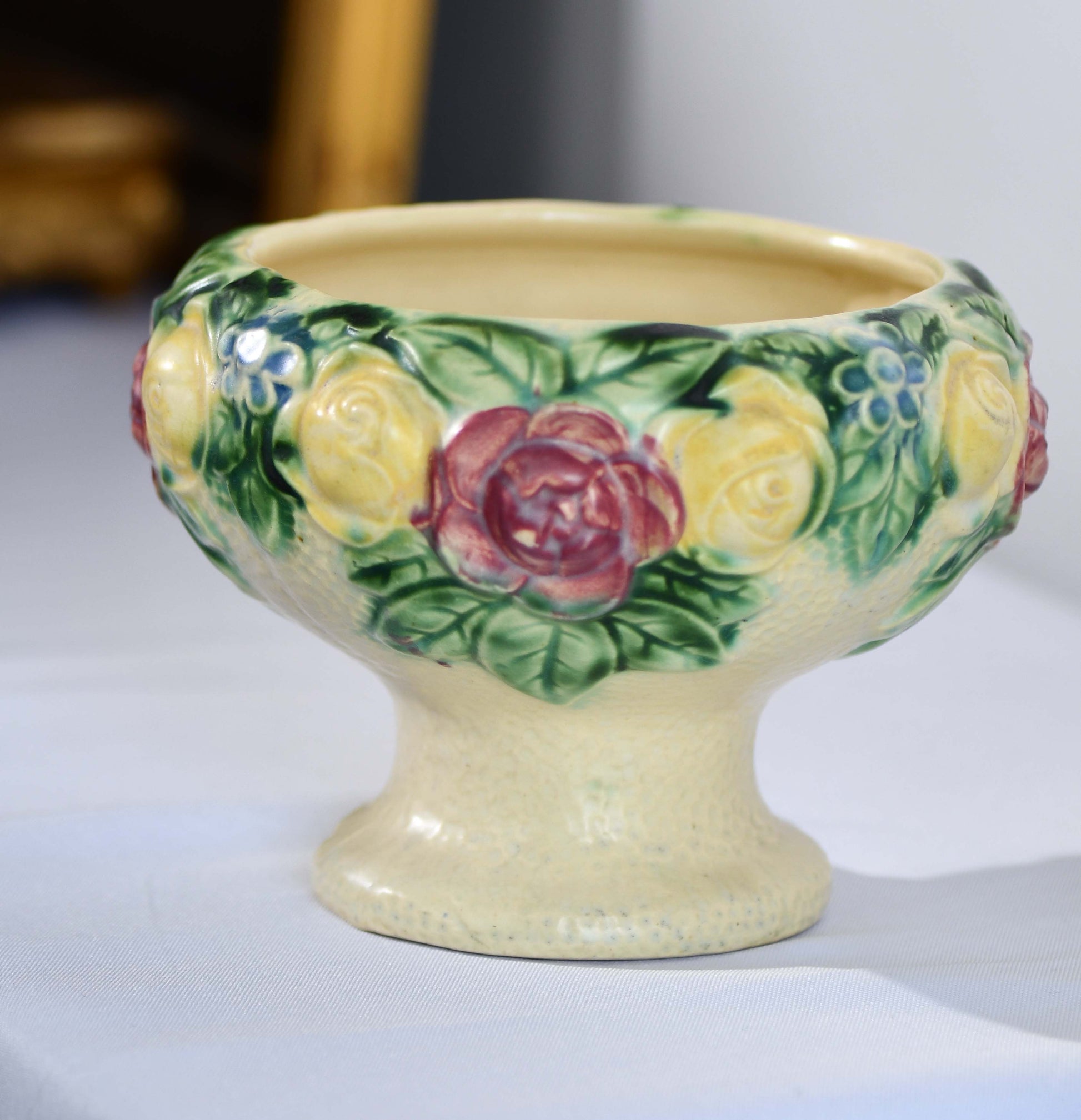 Decorative ceramic bowl with floral patterns on a white background