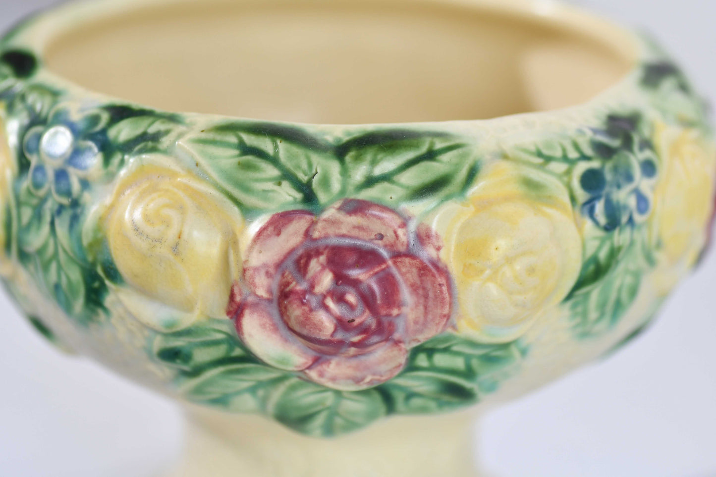 Decorative ceramic bowl with floral patterns on a white background