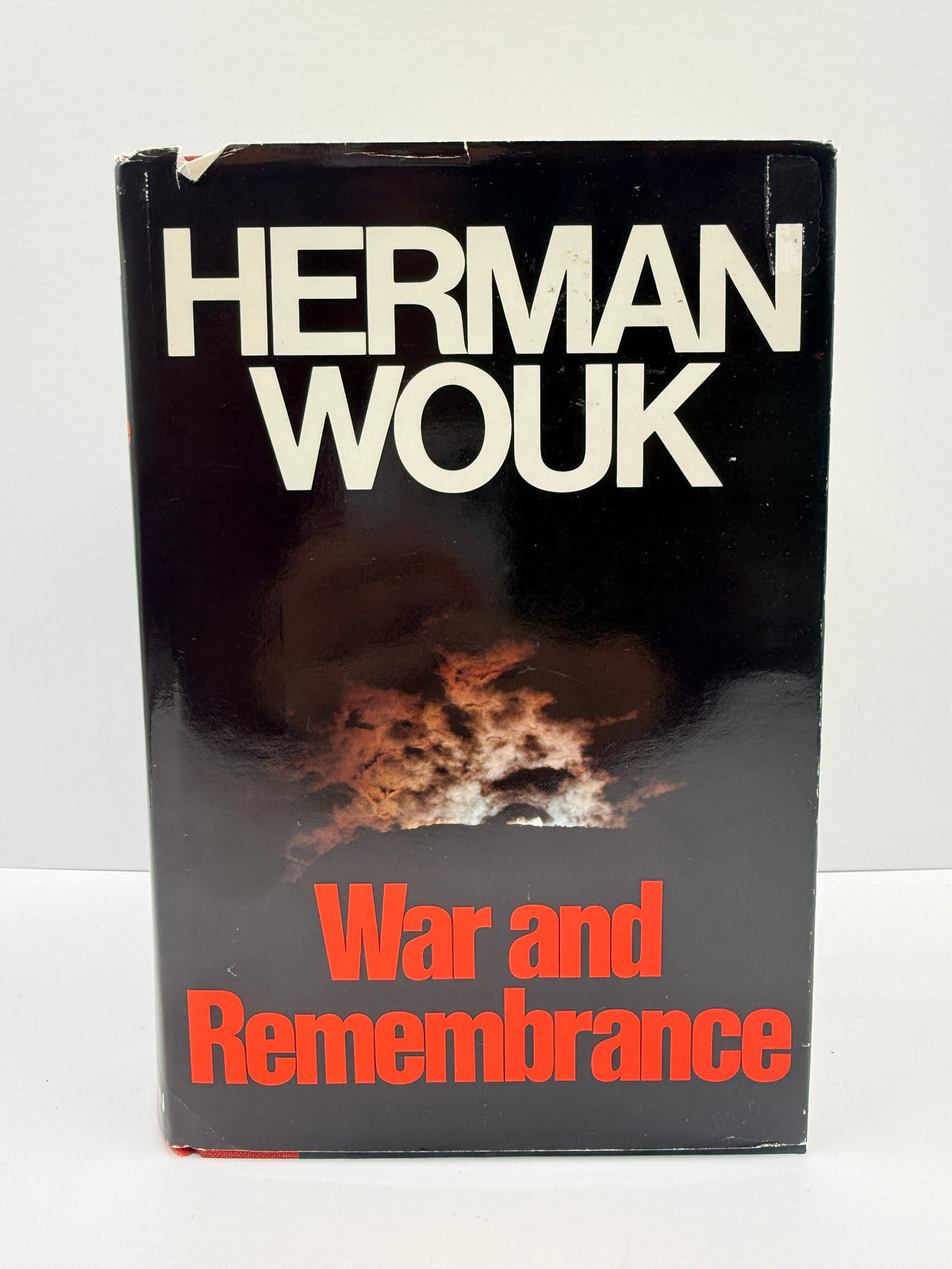 A vintage paperback book of Herman Wouk's 'War and Remembrance' with a black cover, white author name, and red title text, photographed against a plain white background.